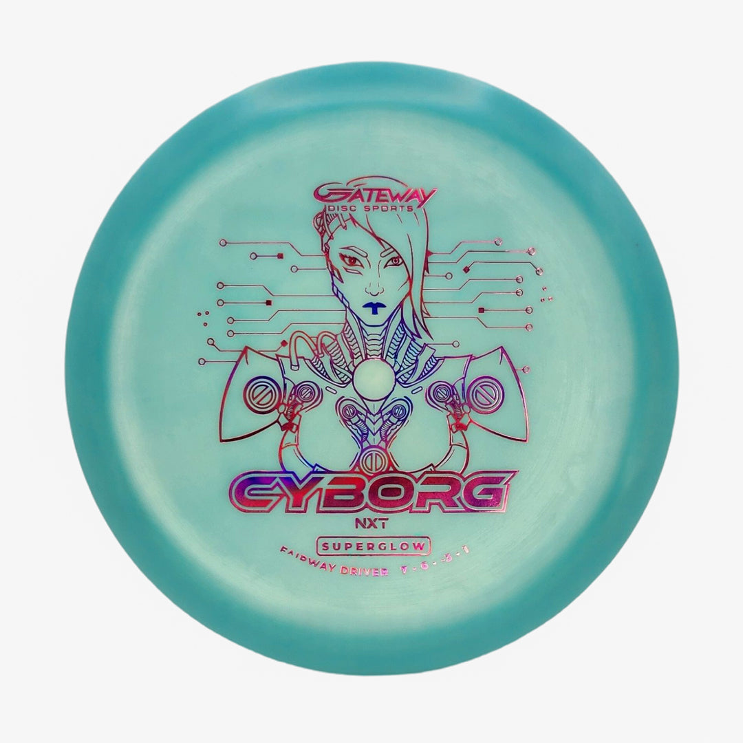 A turquoise, understable fairway driver by Gateway Disc Sports featuring line art of a cyborg woman with geometric and circuit designs, labeled "Cyborg - NXT Superglow.