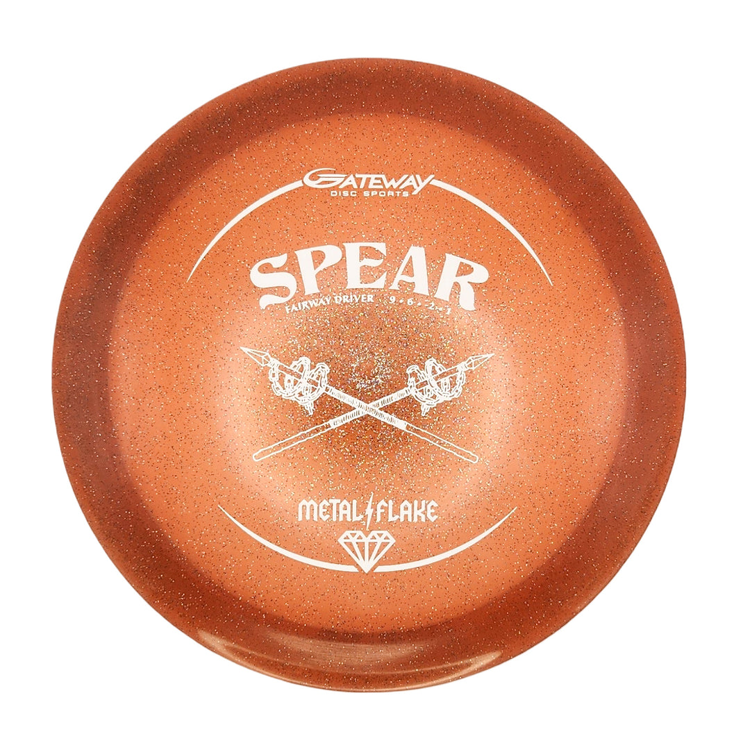 An orange, speckled Gateway Disc Sports Spear - Diamond (Metal Flake) 9-speed fairway driver with crossed spears artwork—designed for reliable, precise, and straight control shots.