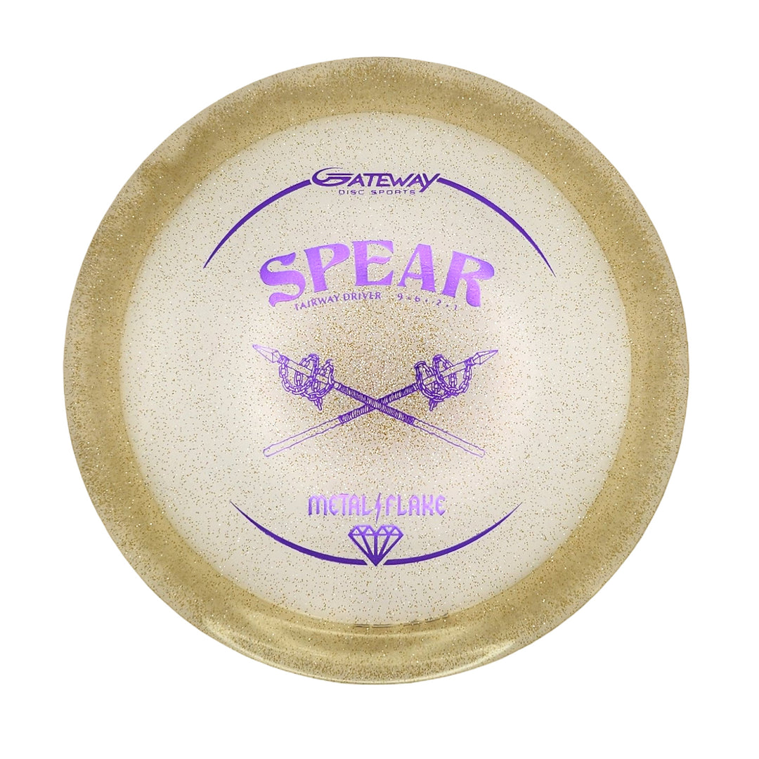 The Spear - Diamond (Metal Flake) is a white and gold 9-speed disc golf driver with gold speckles, purple crossed spear graphics, and the Gateway Disc Sports logo—ideal for straight, precise throws.
