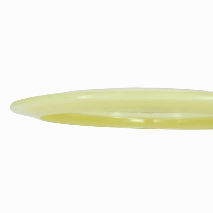 A translucent yellow oval bangle bracelet, reminiscent of the Ether - Diamond Superglow disc, is displayed on a plain white background.