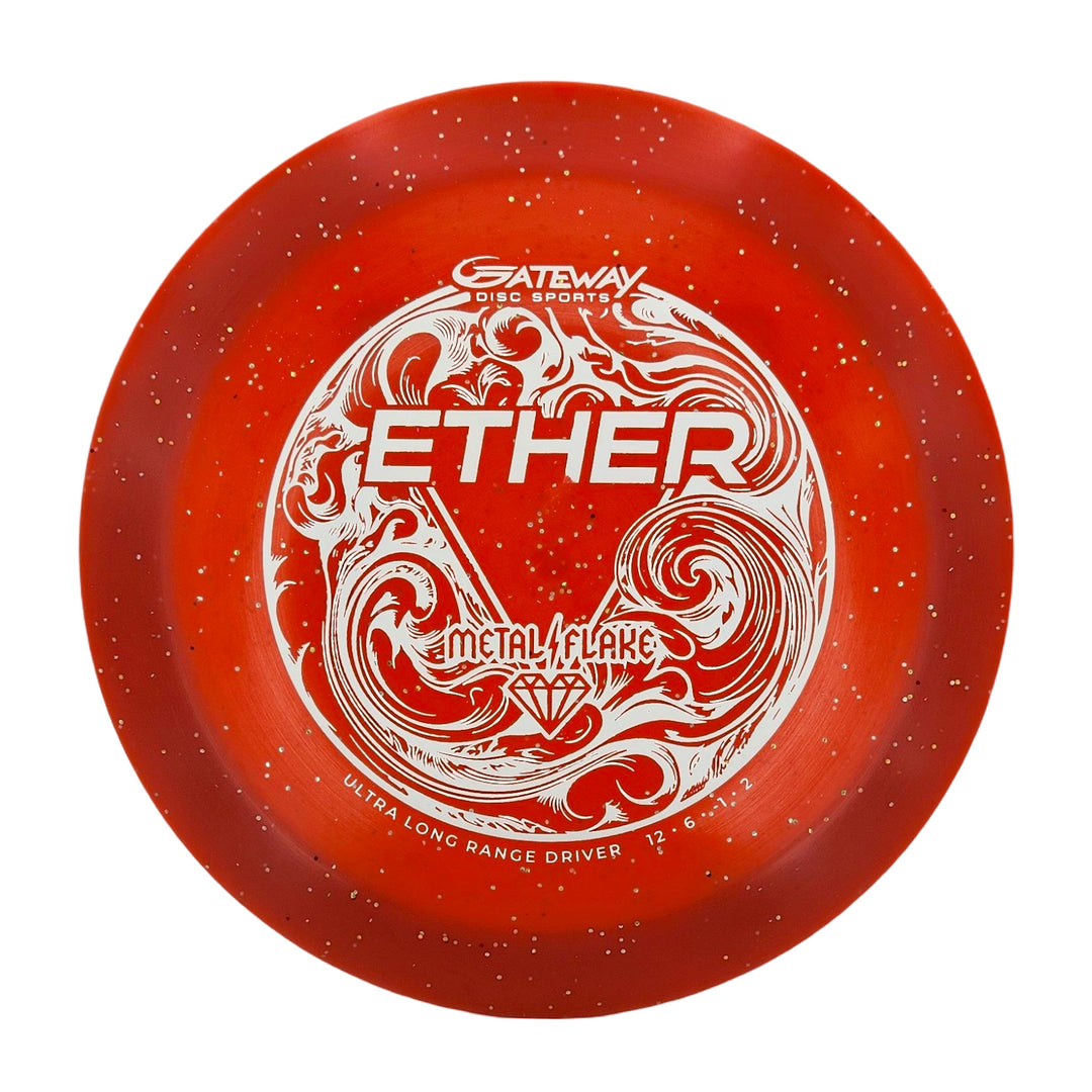 A red Diamond Metal Flake disc golf distance driver with white speckles, ornate white artwork, and "Ether - Diamond Metal Flake" text. PDGA approved ultra long range driver 12|6 for maximum distance throws.