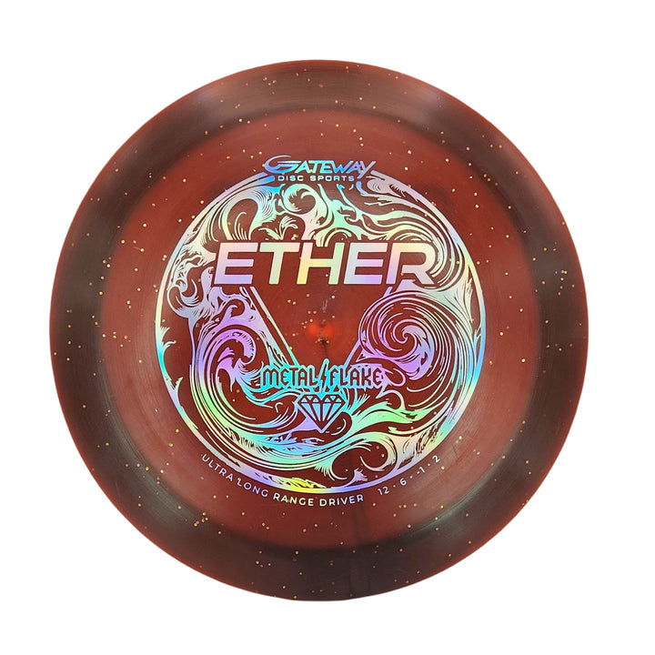 The Ether - Diamond Metal Flake by Gateway Disc Sports is a brown PDGA-approved distance driver with a metallic, colorful —ETHER—� and —METAL FLAKE—� design, ornate swirls, and gold flecks—perfect for maximum distance throws.
