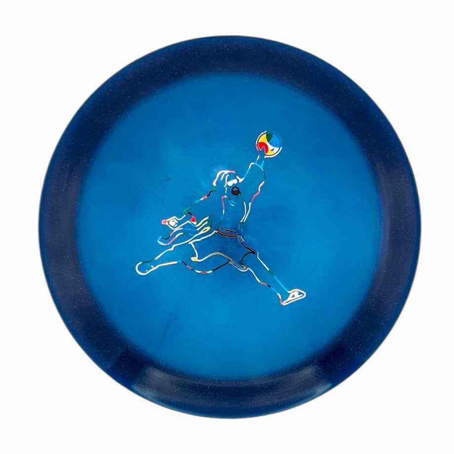 The Realm - Diamond - Air Dude is a blue max distance driver disc golf disc with an outline illustration of a person jumping to catch a disc—ideal for power throwers chasing long, impressive throws.