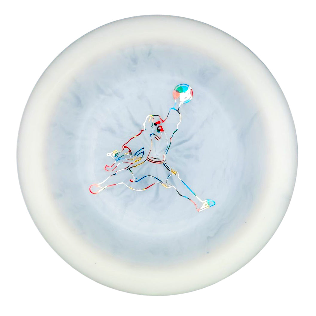 The Spell - Diamond - Air Dude features a white disc with a vibrant, minimalist outline of a jumping basketball player at the center, expertly crafted from high-grade TPU for powerful, wind-crushing throws.