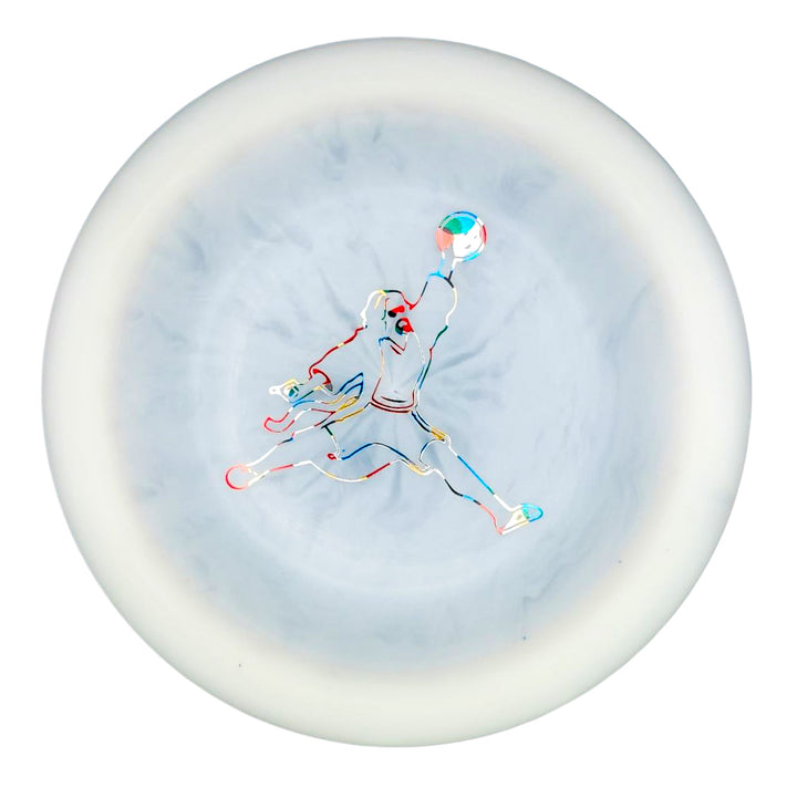 The Spell - Diamond - Air Dude features a white disc with a vibrant, minimalist outline of a jumping basketball player at the center, expertly crafted from high-grade TPU for powerful, wind-crushing throws.