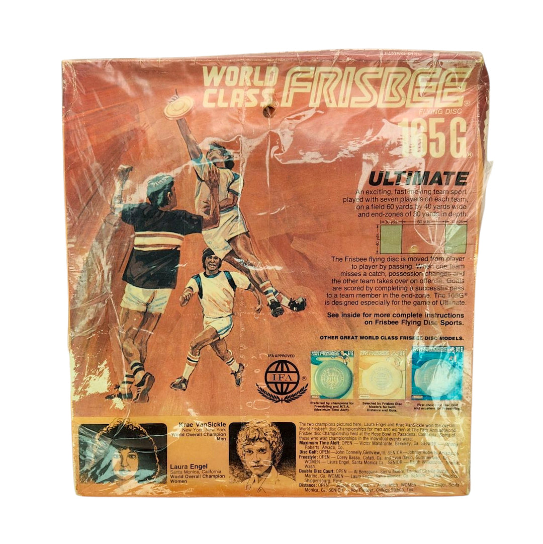 Factory sealed vintage Wham-O World Class - Champion Model Frisbee packaging, featuring illustrations of people playing Ultimate and detailed product info in text.