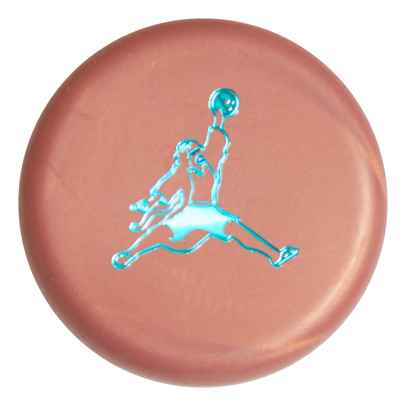 The Air Dude Mini (Large) - SureGrip is a round, metallic pink button featuring a blue basketball player silhouette leaping mid-air with a ball.