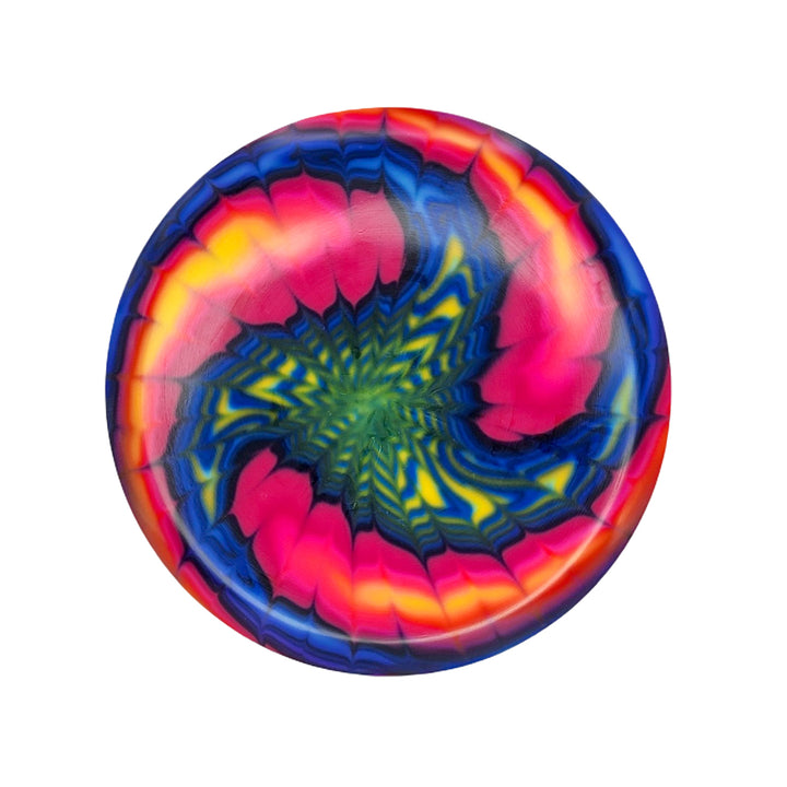 The Element - NXT - Optic Dyes is a round mid-range disc with a vibrant swirl of red, pink, yellow, blue, and green on white—ideal for hand-dyed disc fans or anyone wanting a unique canvas for custom dyes.