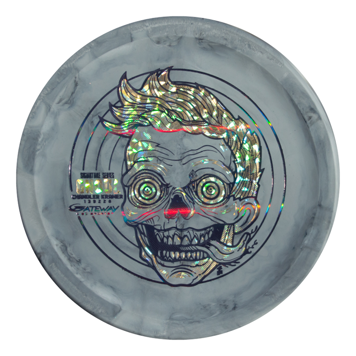 Chandler's Special Edition Ghoul - Lunar: A gray disc golf disc with a holographic wide-eyed, grinning skull illustration, stylized hair, and red nose. Designed for stable flights and comfortable forehand throws.