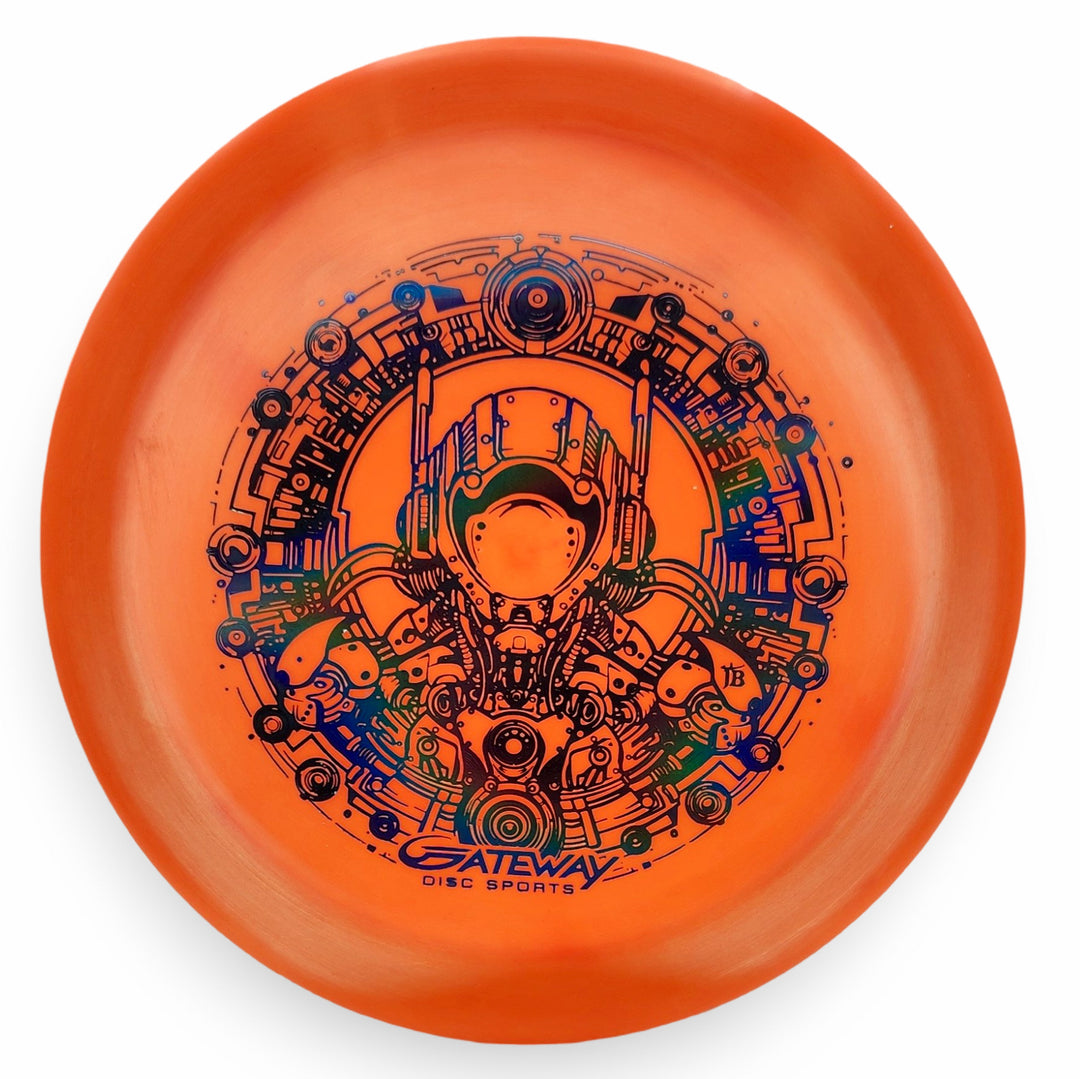 An orange Spell NXT Lite - PremierJUL disc golf disc featuring a detailed black and blue futuristic robot design, ideal for power throws. "Gateway Disc Sports" is printed at the bottom.