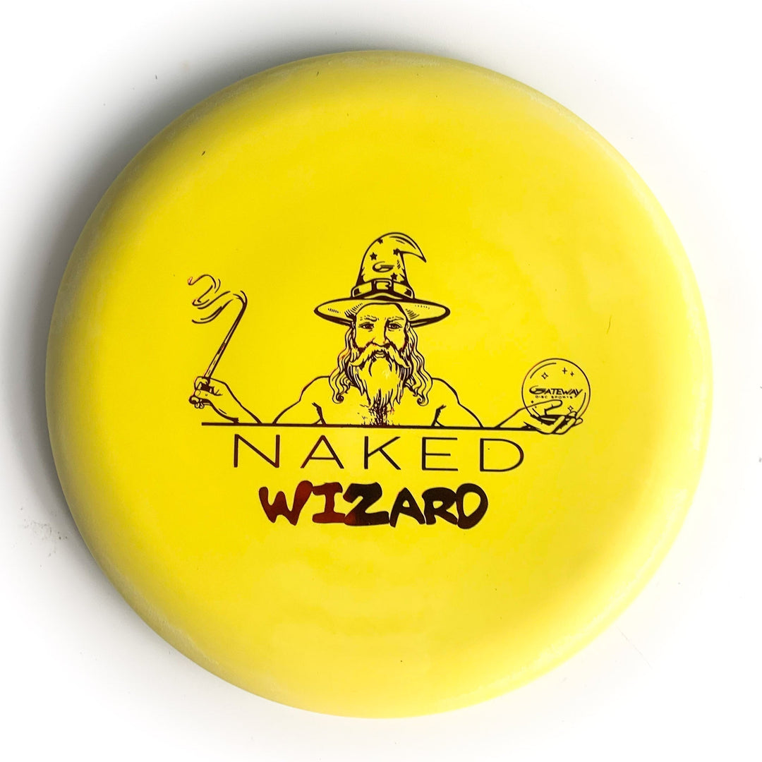 A yellow, firm Wizard disc golf putter featuring a line drawing of a wizard holding a staff and crystal ball with "NAKED WIZARD" text. Ideal for fans of beaded discs and the Naked Wizards series.