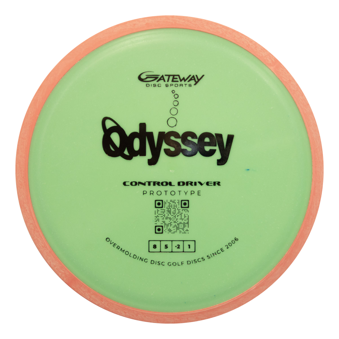 A green and pink Gateway Prototype 93 Odyssey Overmolded control driver disc golf disc features prototype labeling, a front QR code, and delivers impressive flight precision.