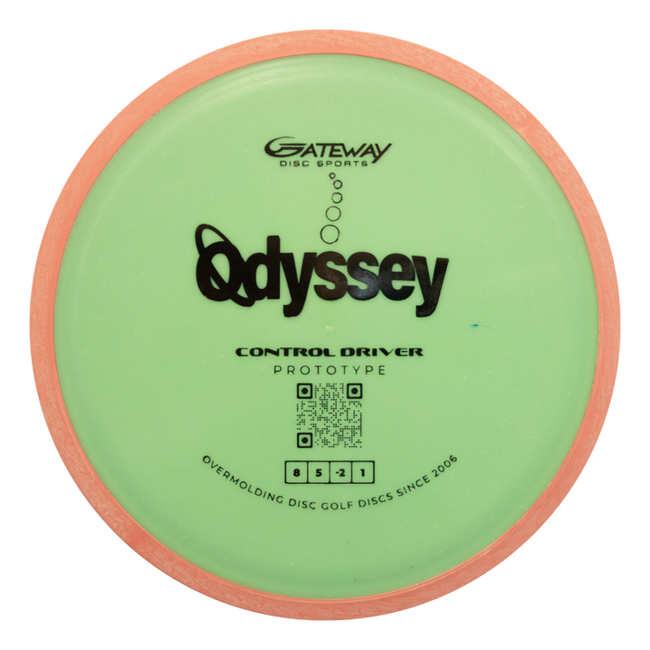 A green and pink Gateway Prototype 93 Odyssey Overmolded control driver disc golf disc features prototype labeling, a front QR code, and delivers impressive flight precision.