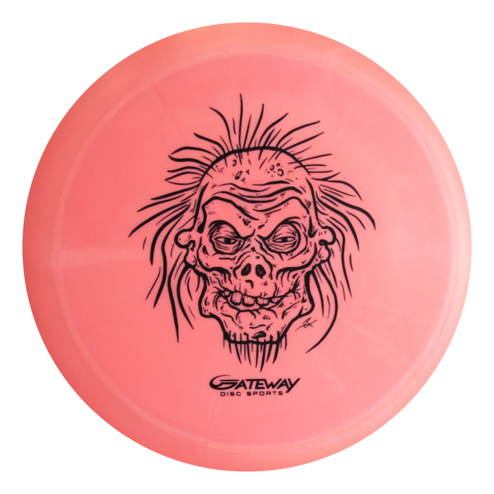 The Speed Demon - Nylon - Premier is a pink, overstable distance driver disc golf disc with a detailed black line drawing of a spiky-haired skull and the Gateway Disc Sports logo. Ideal for powerful backhand flex shots.