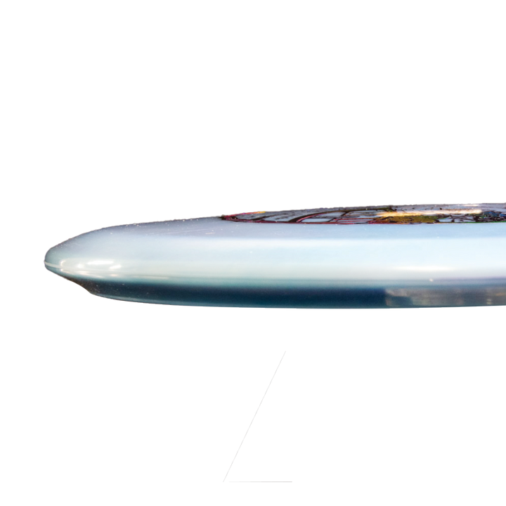 Close-up side view of Sam Smigiel's Element - NXT Color Superglow disc surfboard, featuring a rounded nose, light blue underside, visible artwork, and engineered for exceptional glide across the water.