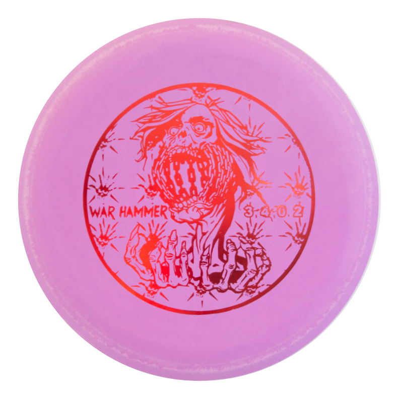 A pink beadless putter disc golf disc featuring a screaming skull above skeletal hands, labeled "Black Zombie Warhammer - ZOMBIE €“ SSSSS" with flight numbers "3.4.0.2" in red€”a true point and shoot putter for your game.