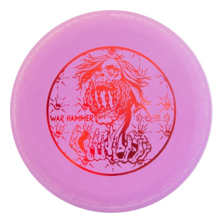 A pink beadless putter disc golf disc featuring a screaming skull above skeletal hands, labeled "Black Zombie Warhammer - ZOMBIE €“ SSSSS" with flight numbers "3.4.0.2" in red€”a true point and shoot putter for your game.