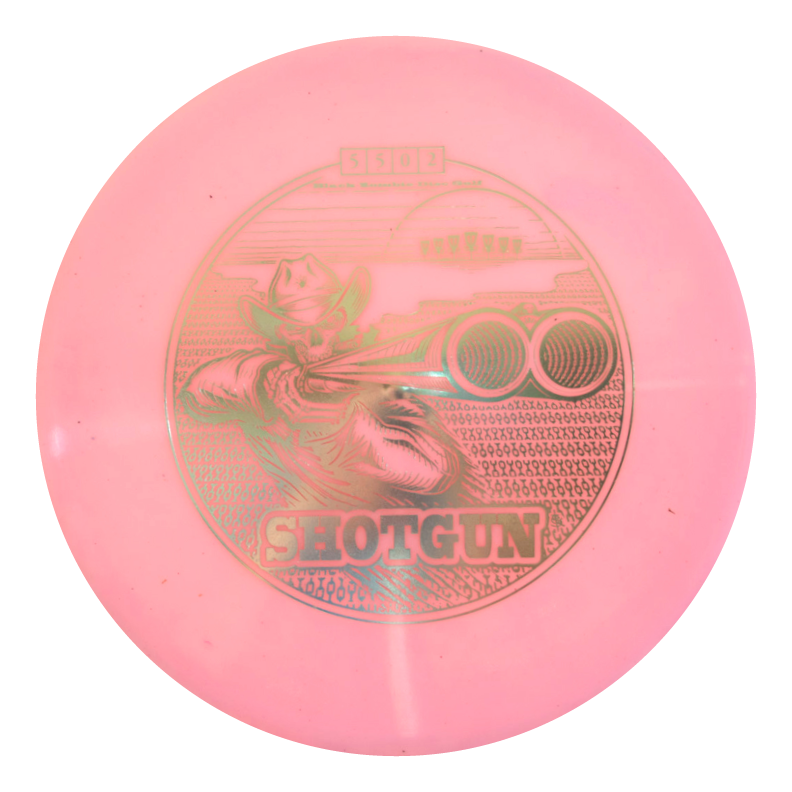 A pink Black Zombie Shotgun €“ Platinum disc golf disc featuring a cowboy aiming a shotgun, with "SHOTGUN" printed below the image.