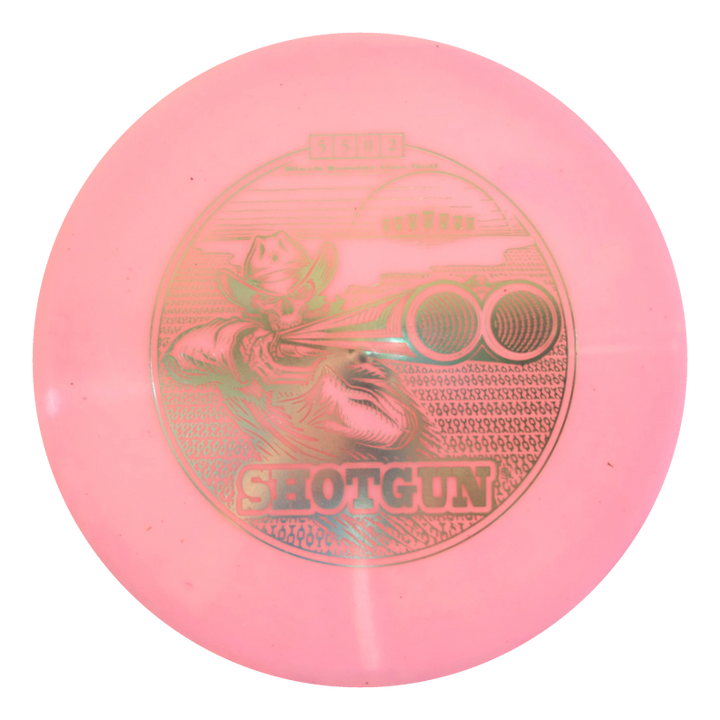 A pink Black Zombie Shotgun €“ Platinum disc golf disc featuring a cowboy aiming a shotgun, with "SHOTGUN" printed below the image.
