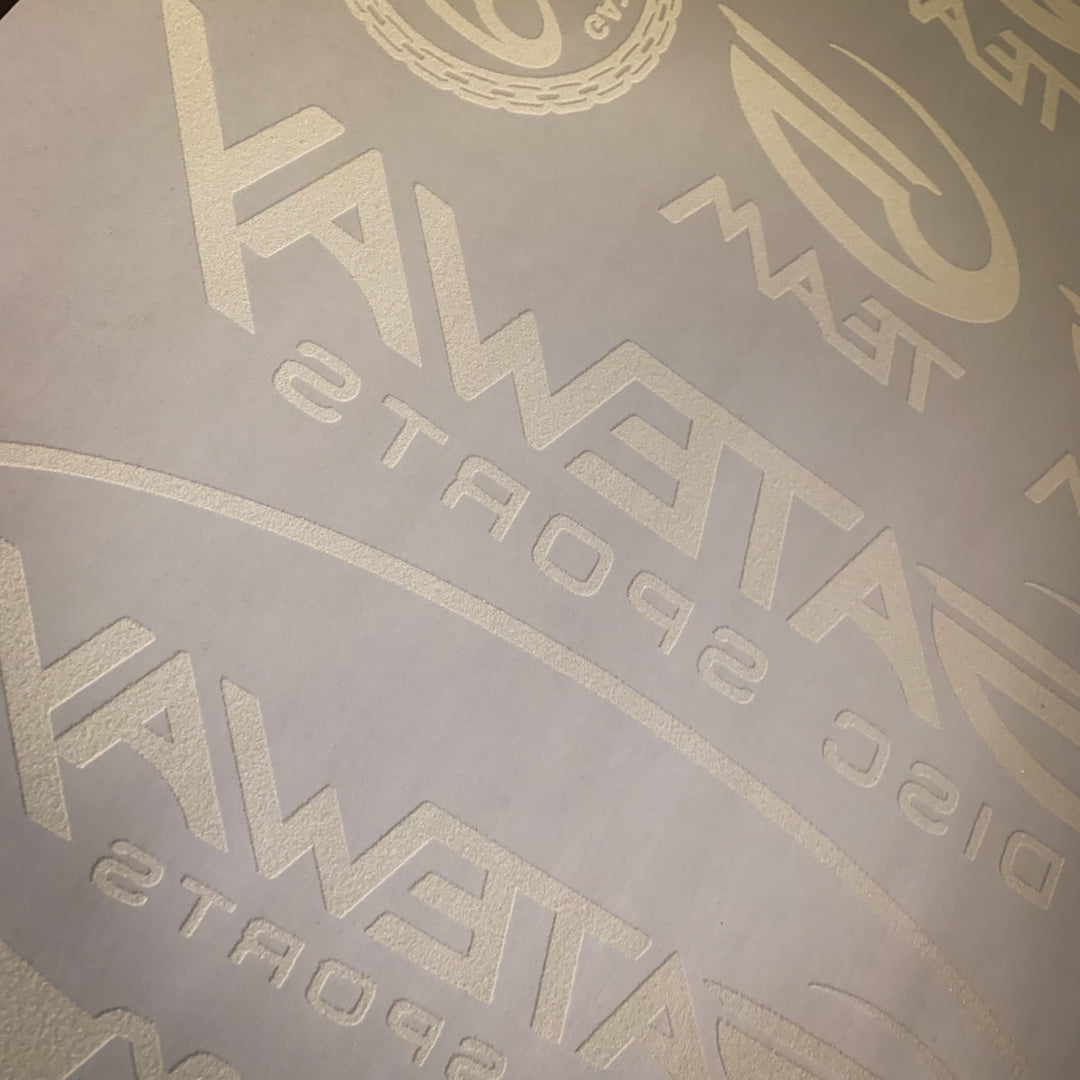 Close-up of an Iron-On Team G Logo Sheet featuring multiple embossed Gateway Disc Sports logos and text€”ideal for team players who want custom designs on heat transfer paper.