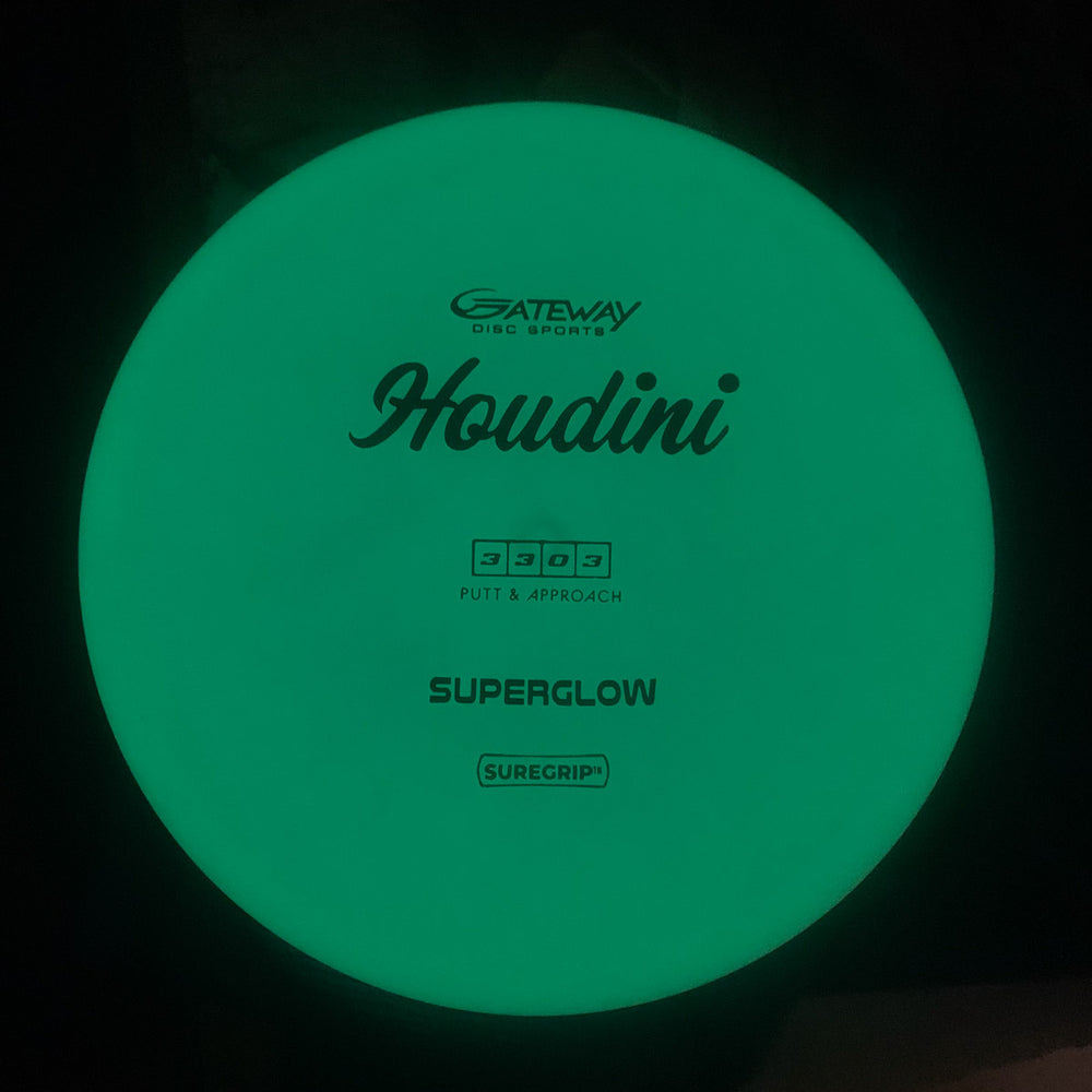 A glowing green Houdini - SureGrip™Superglow putt and approach disc with a deep rim, ideal for power backhands, featuring "Gateway Disc Sports Houdini - SureGrip™Superglow" printed on it.