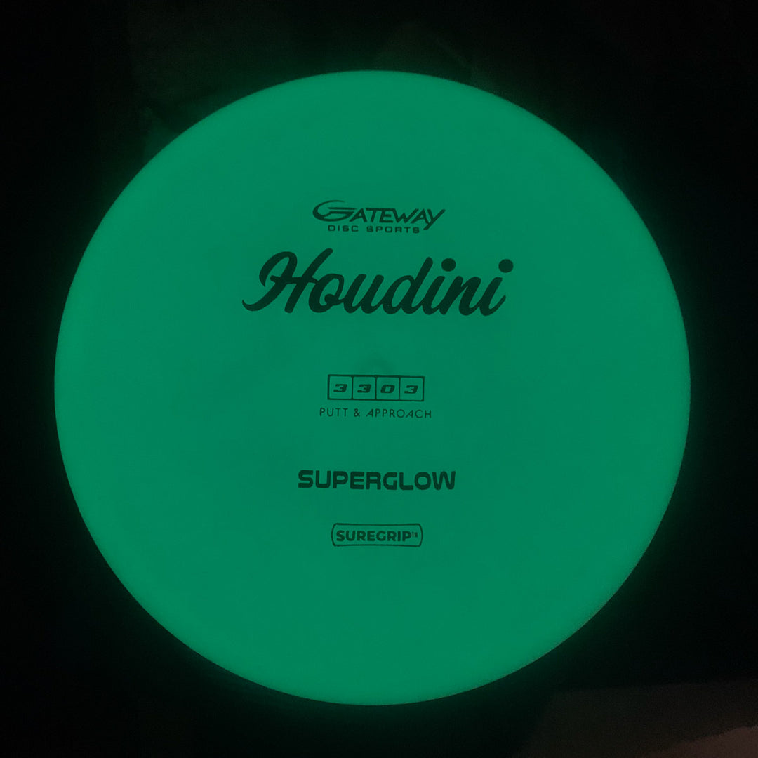 A glowing green Houdini - SureGrip™Superglow putt and approach disc with a deep rim, ideal for power backhands, featuring "Gateway Disc Sports Houdini - SureGrip™Superglow" printed on it.