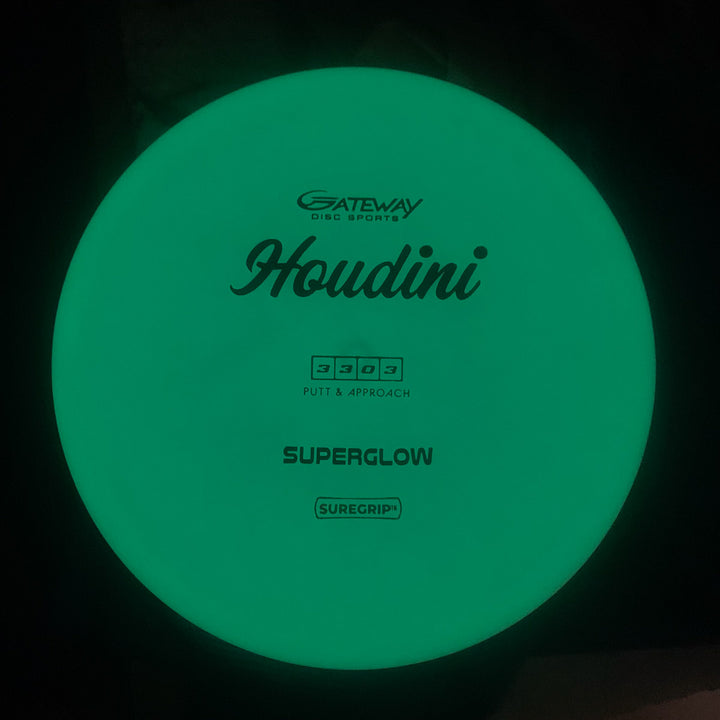 A glowing green Houdini - SureGrip™Superglow putt and approach disc with a deep rim, ideal for power backhands, featuring "Gateway Disc Sports Houdini - SureGrip™Superglow" printed on it.