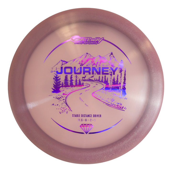 A pink long-range distance driver named "Journey - Diamond" by Gateway Disc Sports, featuring a purple winding road, mountains, and trees graphic€”designed for controllable flight on the course.