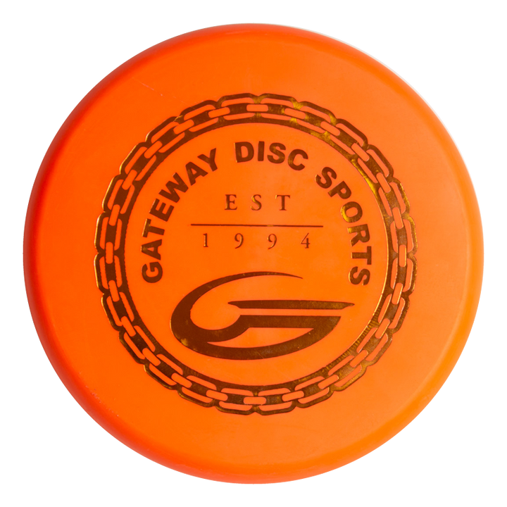 An orange Lil Wizard - SureGrip™  6-1/2" mini disc featuring "Gateway Disc Sports EST 1994" and a stylized "G" logo inside a chain ring design.