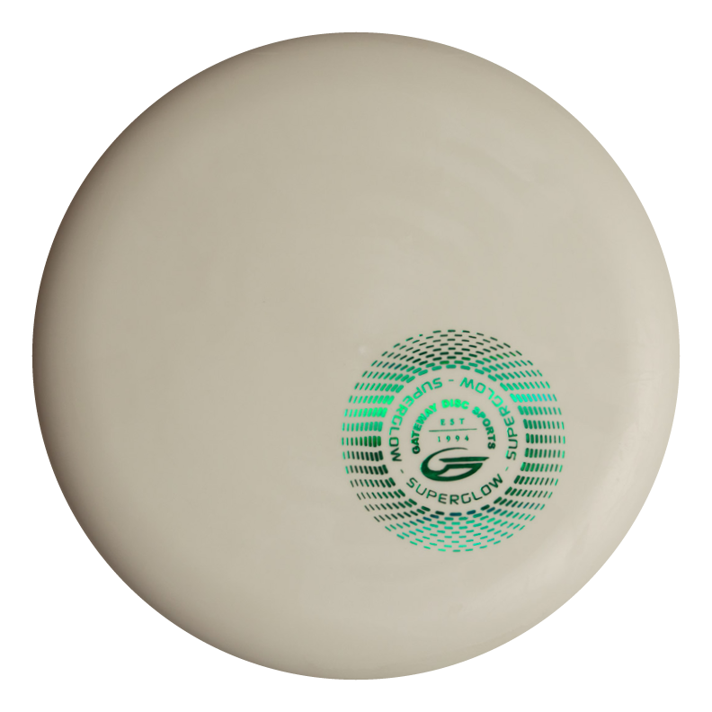 A white Magic - Suregrip Superglow - SS disc golf disc with green and black graphics in the center. This straight-flying disc offers easy control, making it ideal for players who want accuracy on the course.