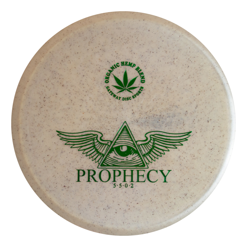 The Prophecy - Diamond Hemp is an overstable white mid-range disc golf disc featuring green graphics (eye in triangle with wings), "PROPHECY," flight numbers 5 5 0 2, and a hemp plant logo labeled "ORGANIC HEMP BLEND" for reliable flights.