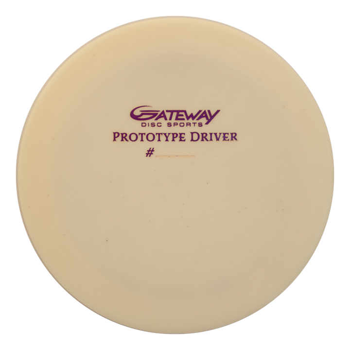 A cream-colored Prototype 136 - NXT (Javelin) disc golf distance control driver with "Gateway Disc Sports Prototype Driver #" printed in purple text on the top.