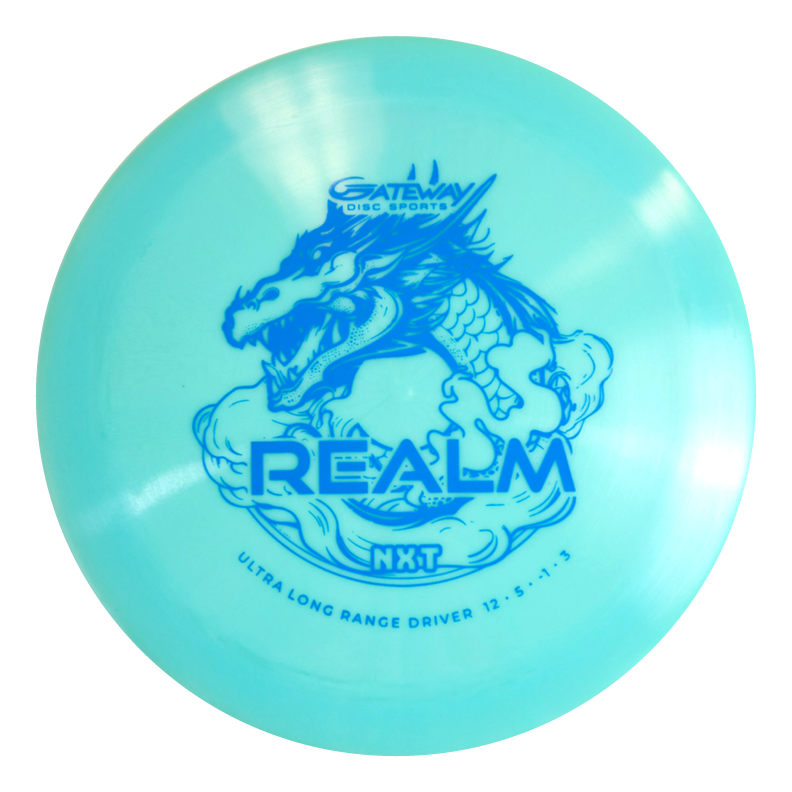 The Realm NXT - Dragon is a light blue distance driver by Gateway Disc Sports, featuring a dragon graphic and marked "ULTRA LONG RANGE DRIVER 12 €¢ 5 €¢ -1 €¢ 3," designed for power throwers in durable plastic.