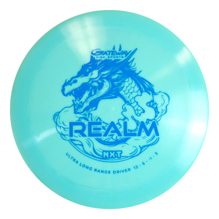 The Realm NXT - Dragon is a light blue distance driver by Gateway Disc Sports, featuring a dragon graphic and marked "ULTRA LONG RANGE DRIVER 12 €¢ 5 €¢ -1 €¢ 3," designed for power throwers in durable plastic.