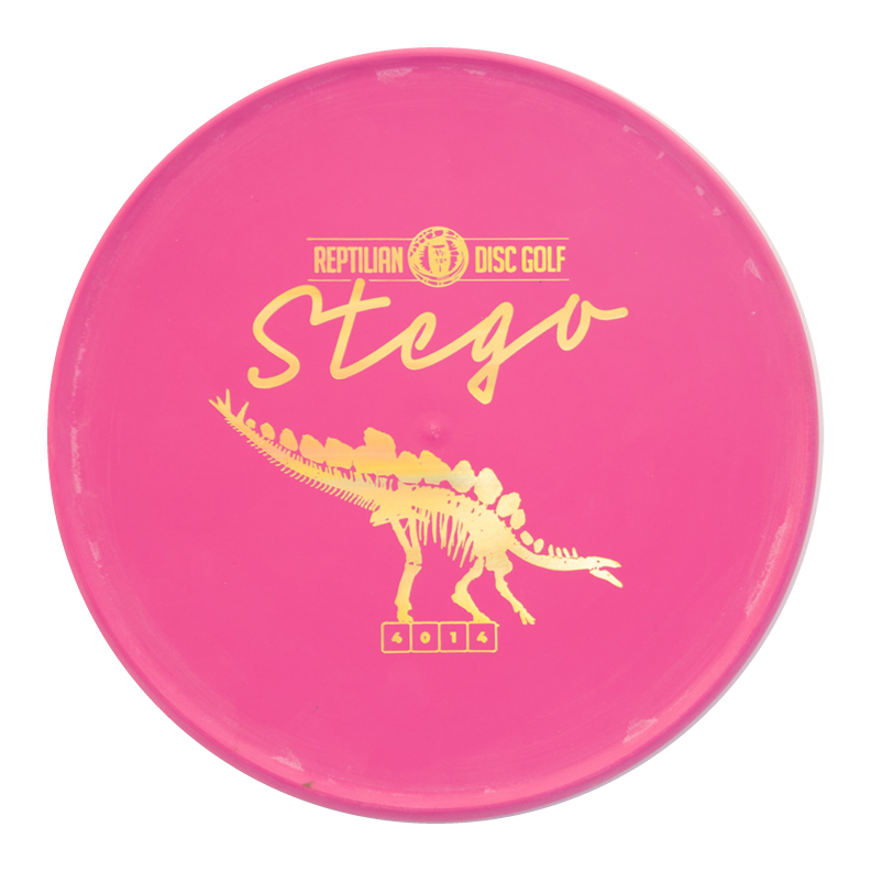 A pink Reptilian DG Stego — Fossil disc with yellow "Stego" text and a dinosaur graphic, famously called the #WorstDiscEverMade for its unique Flight Numbers and unforgettable throwing experience.
