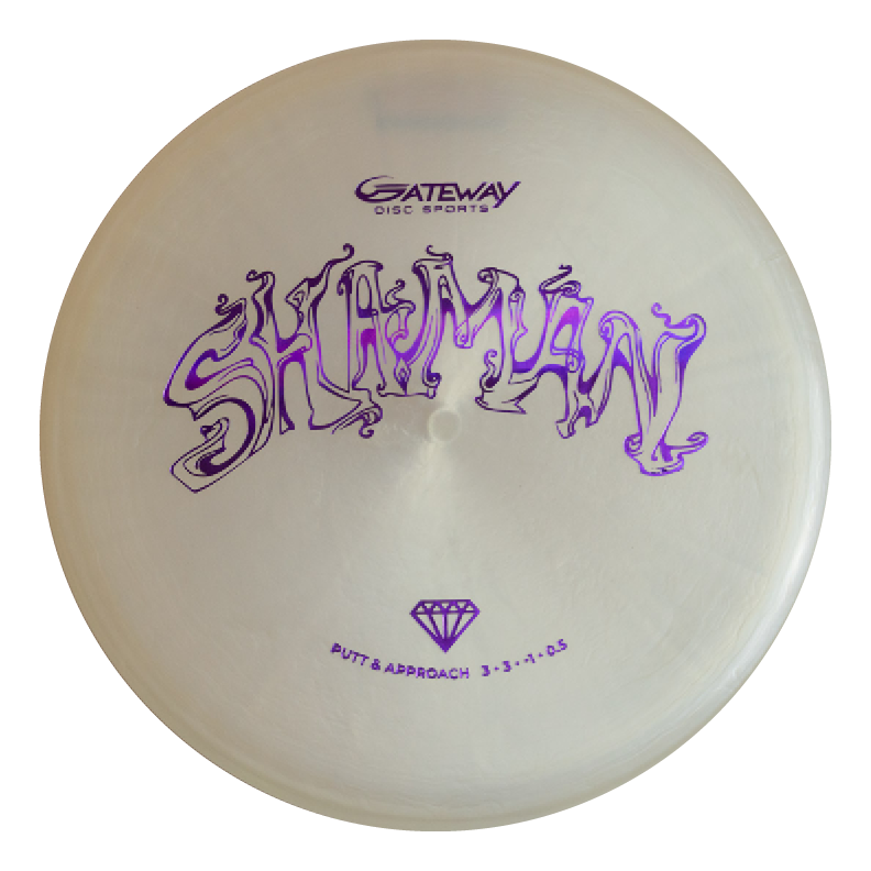 The Shaman - Diamond is a white disc golf putter featuring "SHAMAN" in stylized purple, "Gateway Disc Sports," and flight numbers€”an enchanting addition to any player's bag.