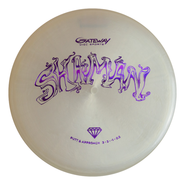 The Shaman - Diamond is a white disc golf putter featuring "SHAMAN" in stylized purple, "Gateway Disc Sports," and flight numbers€”an enchanting addition to any player's bag.