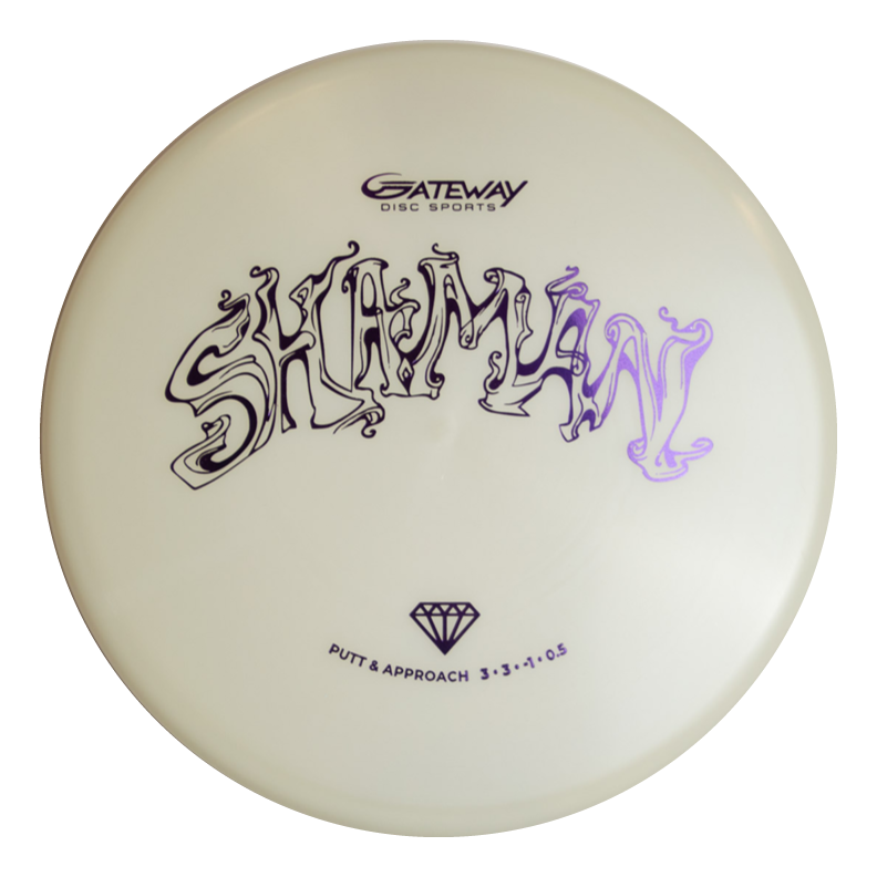 The Shaman - Diamond Superglow is a white disc golf putter with "Shaman" in stylized black text and the "Gateway Disc Sports" logo above it, designed for a consistent flight path.