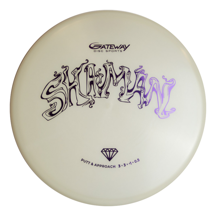 The Shaman - Diamond Superglow is a white disc golf putter with "Shaman" in stylized black text and the "Gateway Disc Sports" logo above it, designed for a consistent flight path.