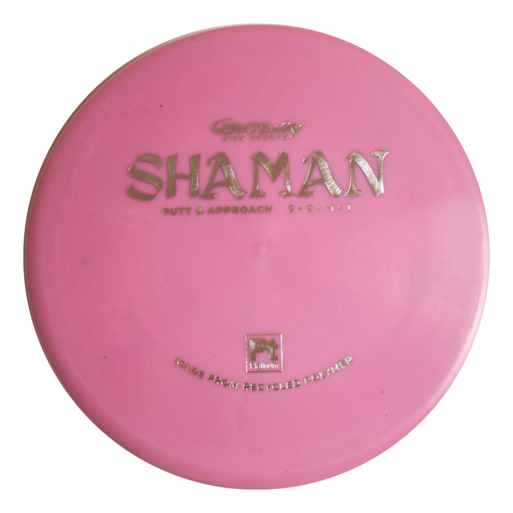 The Shaman - Platinum is a pink disc golf putter labeled "Putt & Approach" and made from over 100% recycled material, making it a sustainable choice for eco-conscious players.