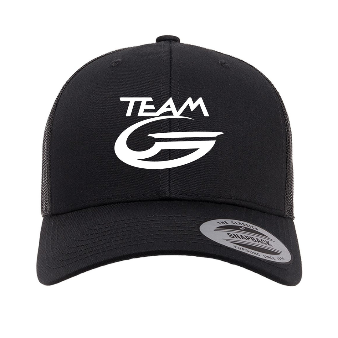 The Team Gateway Trucker Cap is black with white "TEAM G" text and logo on the front, featuring a mesh back and an adjustable snapback closure for comfort.