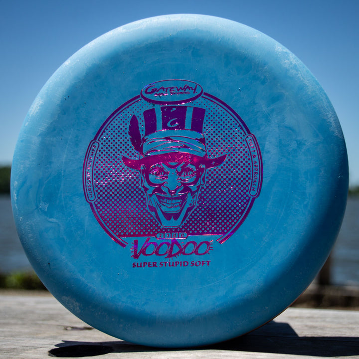 A blue Voodoo - Suregrip - SSS disc golf putter with a purple grinning magician graphic and "Gateway Disc Sports" on the front—perfect as a straight putter or broken-in Wizard for reliable clutch lay-ups.
