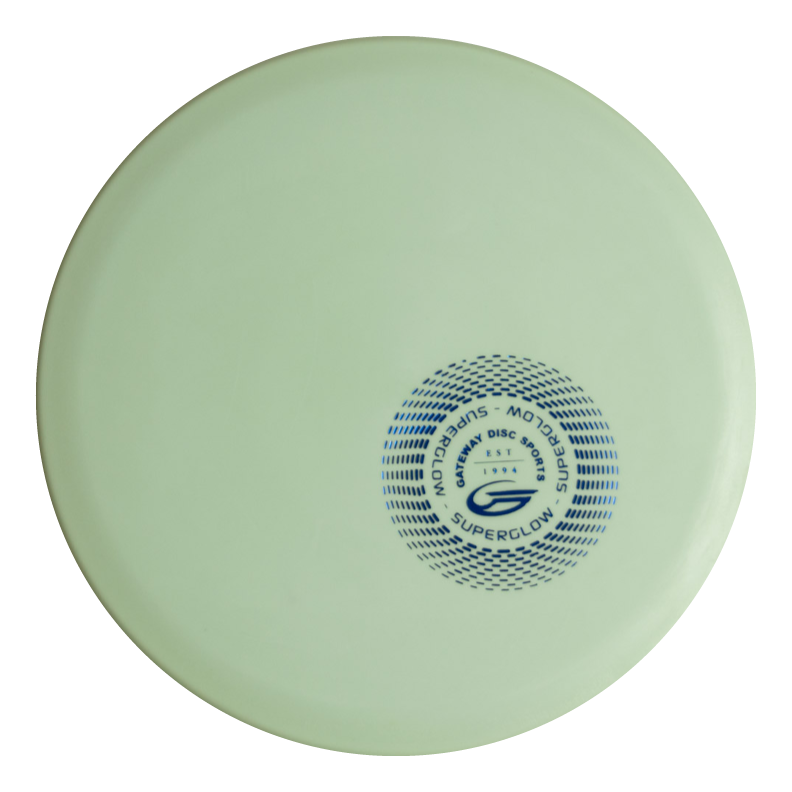 A light green, overstable Warrior - SureGrip™ Superglow frisbee featuring a circular blue logo and the text "Superglow," "Montagu Disc Golf," and "Warrior" near the center.