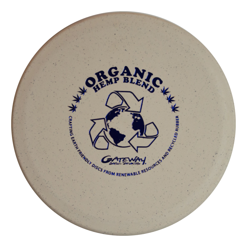 The Warrior - Organic Hemp is a beige mid-range disc frisbee with "Organic Hemp Blend" text and a recycling symbol above a globe, labeled "Gateway Disc Sports.