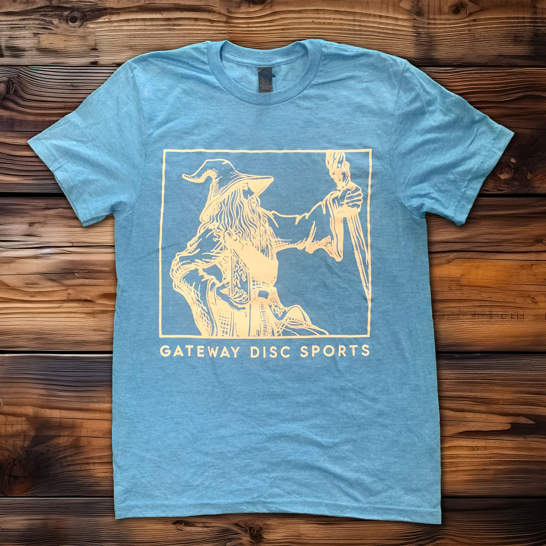 White Wizard T-shirt featuring a line drawing of a wizard holding a staff, with "GATEWAY DISC SPORTS" printed below€”ideal for fans celebrating the 30th Anniversary with this retro logo design.