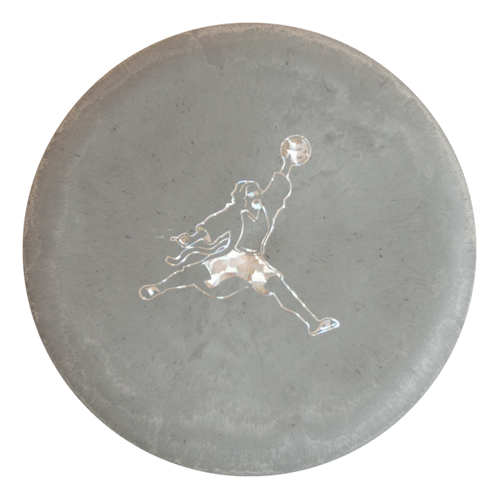 The Wizard Lunar - Air Dude features a round, gray concrete design with a central white silhouette of a person in motion holding a ball, capturing the essence of Gateway Disc Sports putters and disc golf.