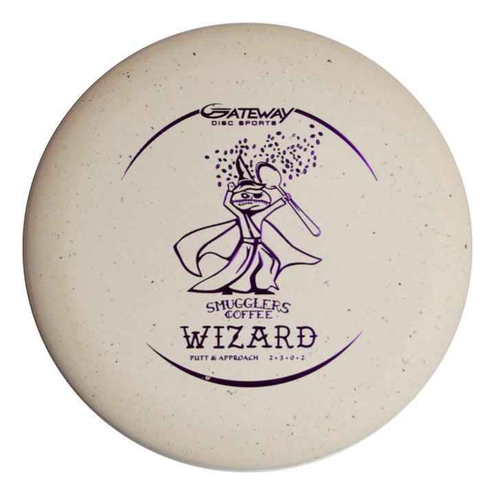 A beige disc golf putter branded "Gateway Disc Sports," featuring a purple wizard with a coffee cup and spoon, labeled €œSmugglers Coffee Wizard,€� inspired by Wizards of the Tomb of Caffeination. Product: Wizard €“ Spoon Smugglers Coffee Special Blend.