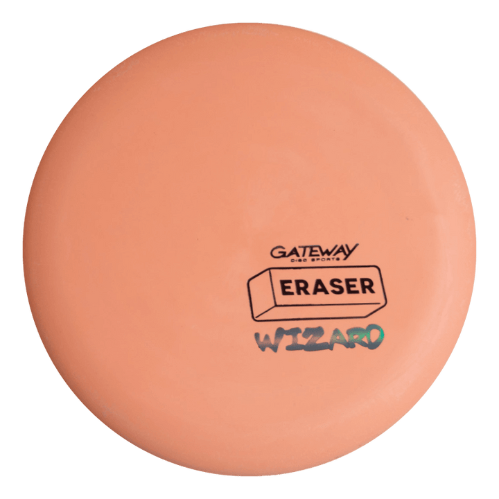 The Wizard - Eraser is a stable, peach-colored disc golf putter featuring the Gateway logo and "ERASER" and "WIZARD" text. It excels at mid-range drives and delivers reliable performance, even in windy conditions.
