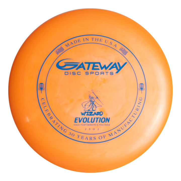 An orange Wizard - Evolution - Neon disc from Gateway Disc Sports, with blue text and graphics, celebrates 30 years of manufacturing and is marked "Made in the U.S.A.