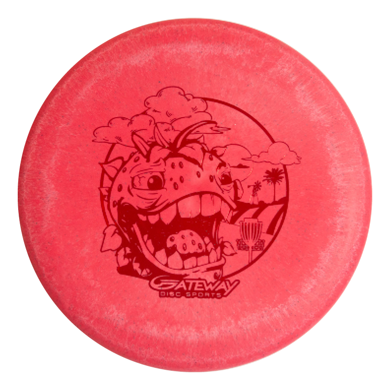 The Wizard Strawberry Hemp is a red disc golf disc with a cartoon dinosaur head, trees, a basket, and "Gateway Disc Sports" logo€”ideal for mid-range drives or pairing with your favorite stable putter.